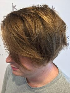 Messy blonde cut with long choppy layers.