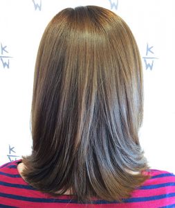 Shoulder length brunette with golden brown layers.